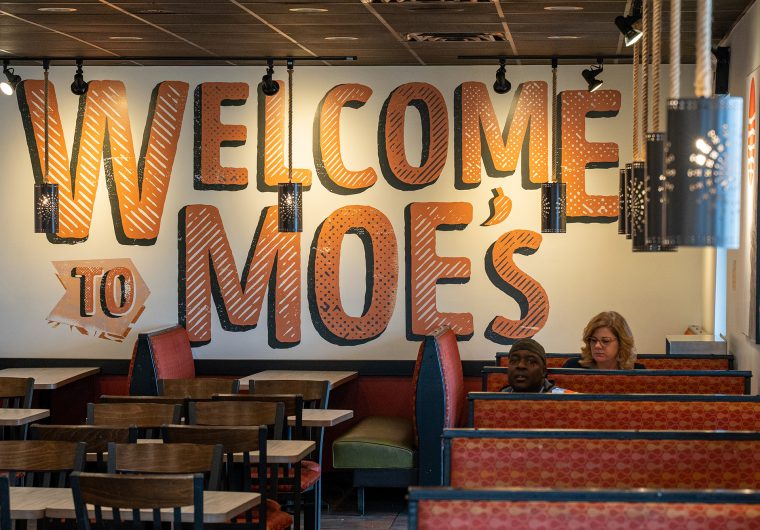 Dining area at a Moe's Southwest Grill built by VIBE Commercial